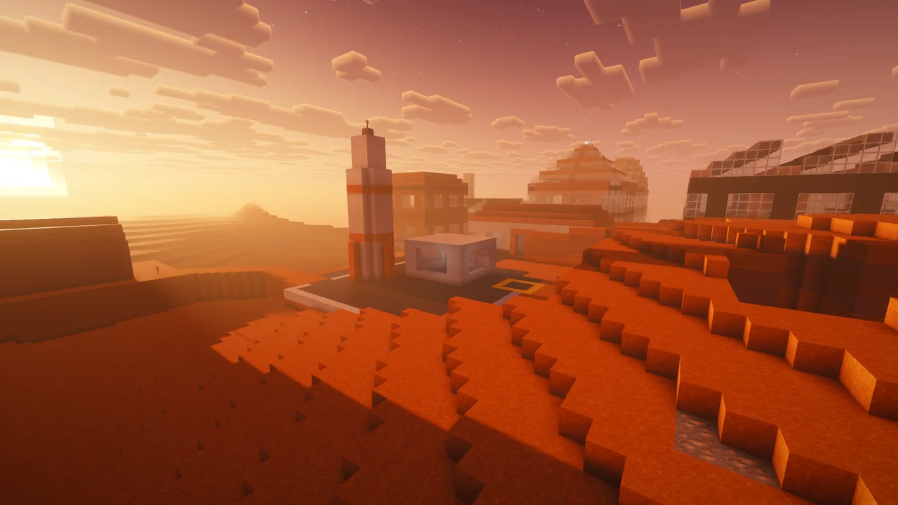 Real in-game screenshot with a shader pack: the Mars refuge and its static rocket at golden hour, terraced red ground in warm light.
